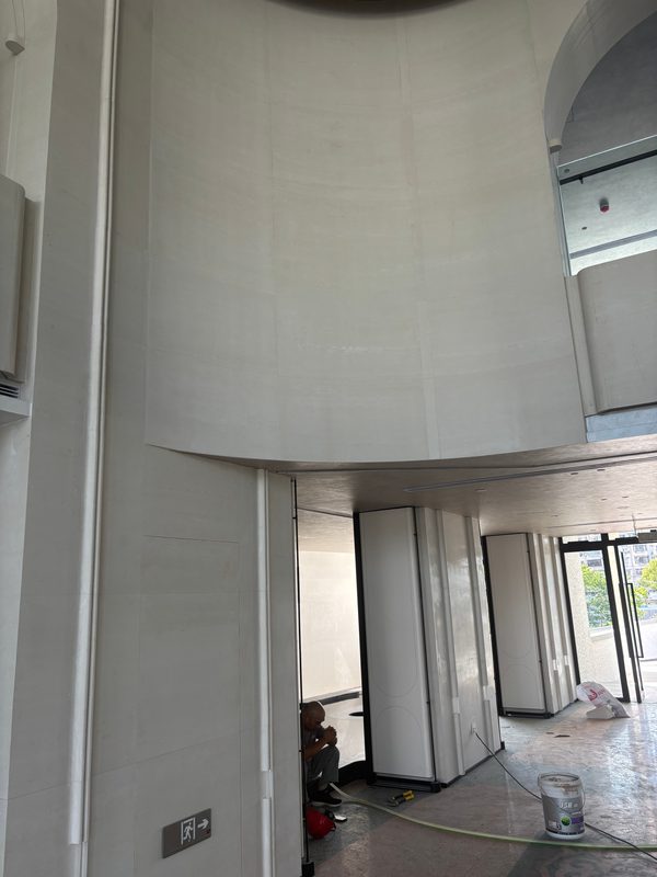 Curved cast stone wall on a large radius