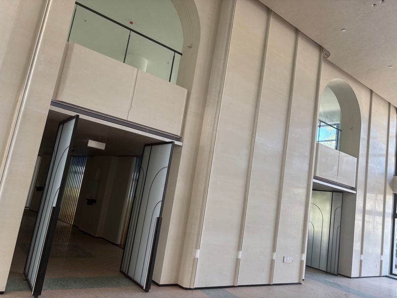 Installed fluted cast stone arcade at full height