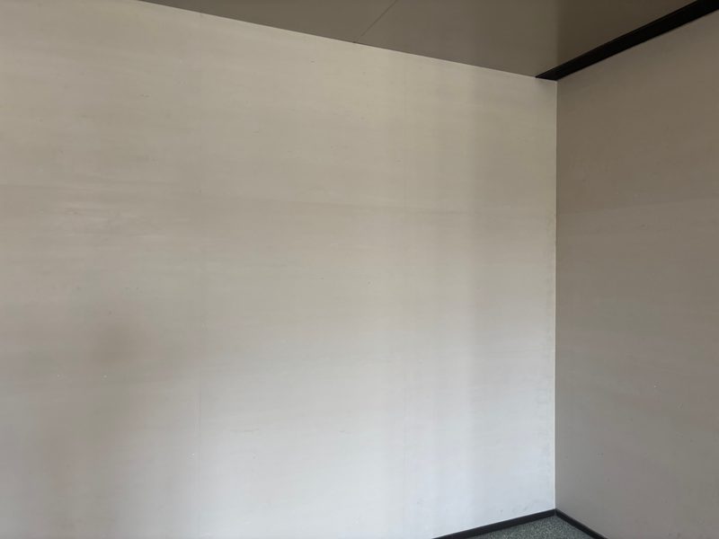 Installed cast travertine wall with fine horizontal banding